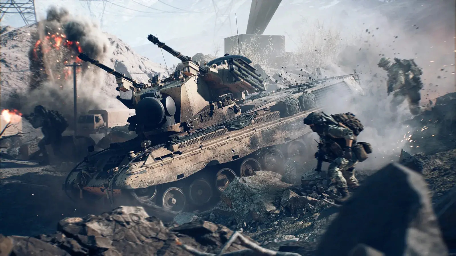 Tank v kouři a troskách, vedle běží voják