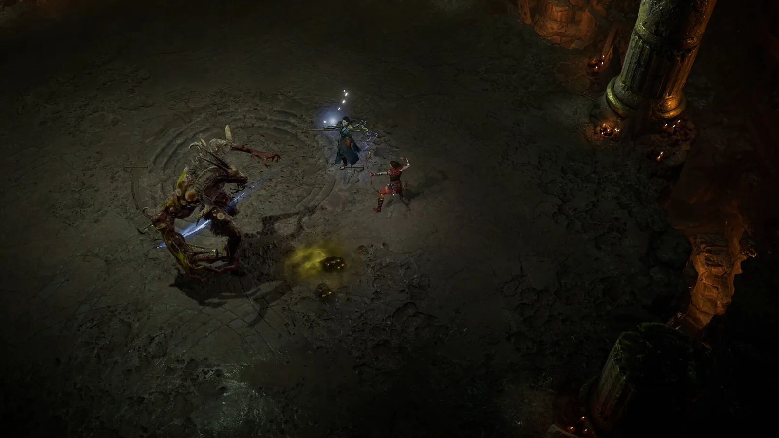Dvě postavy v temném dungeonu Diabla IV bojují s kostnatou příšerou
