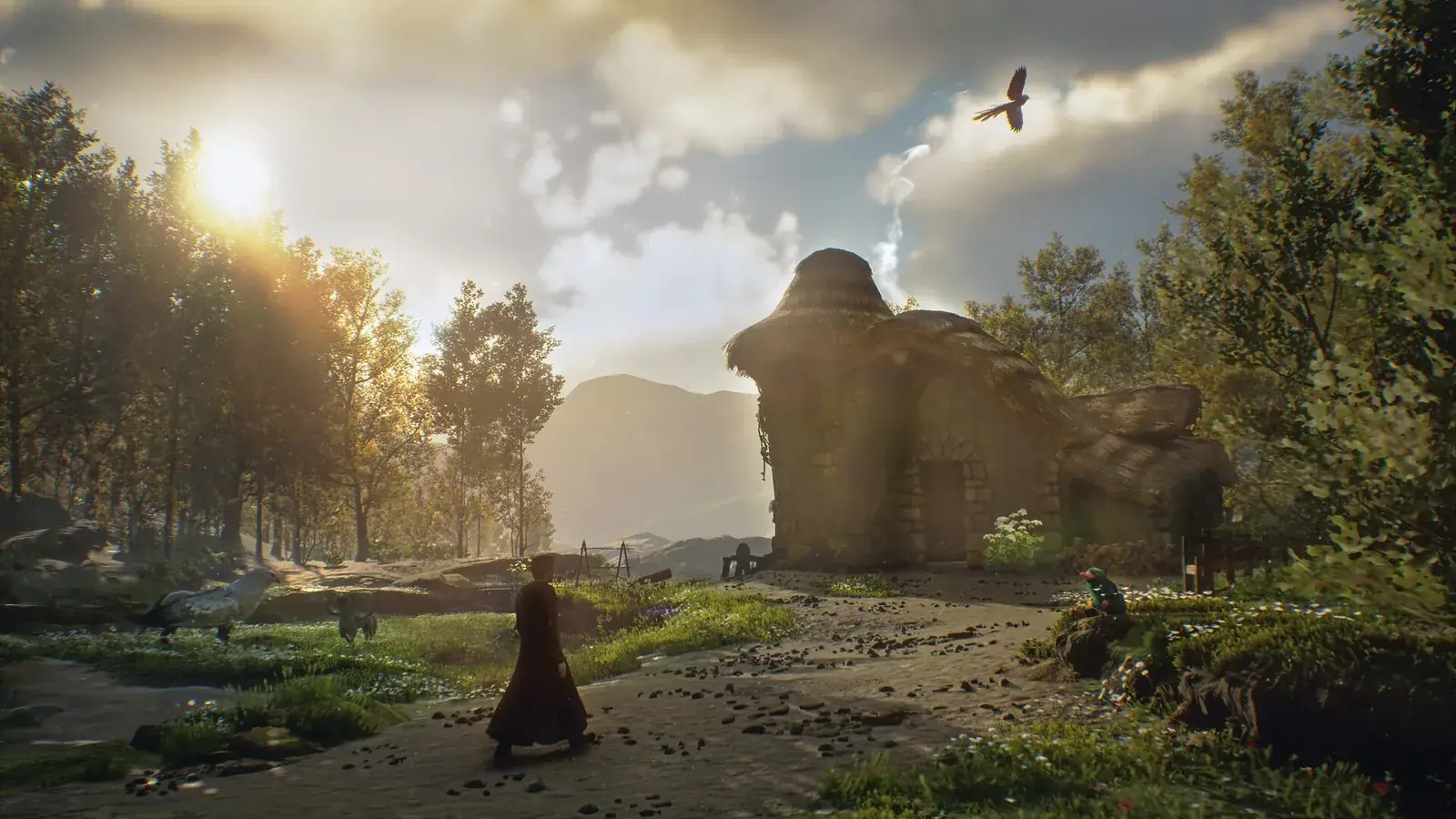 Slunečná krajina s kamenným domkem a postavou na cestě v Hogwarts Legacy