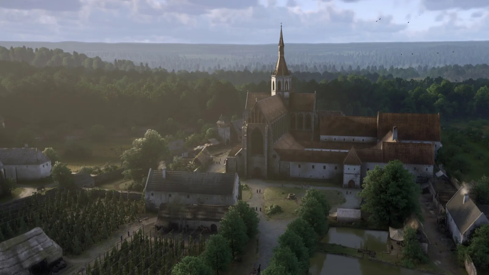 Letecký pohled na Sedlecký klášter a okolní krajinu v Kingdom Come: Deliverance 2