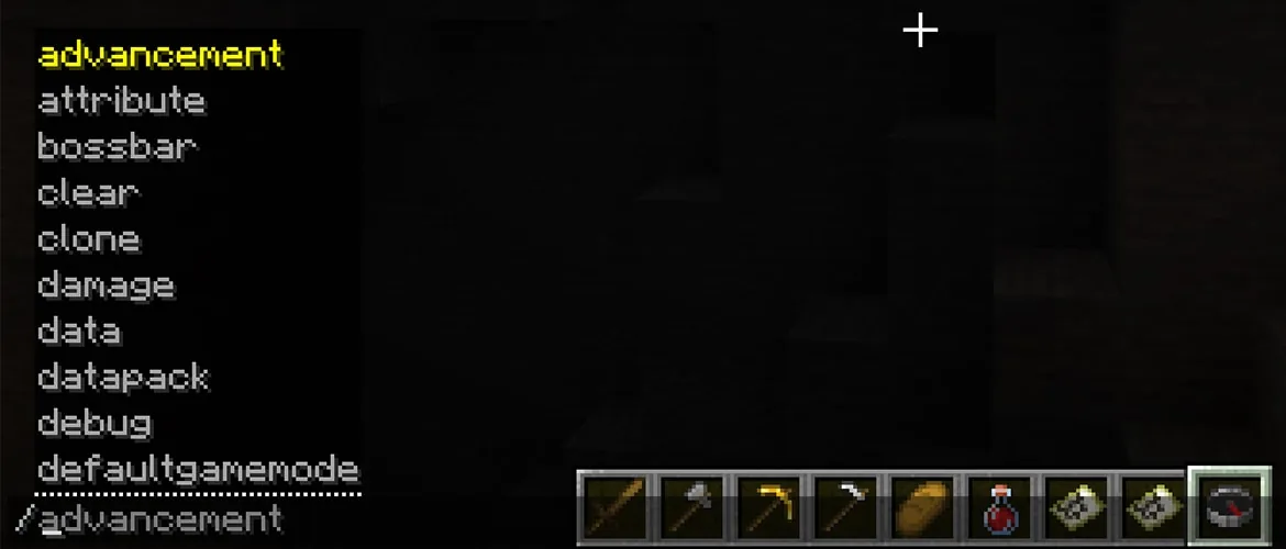 Minecraft chat with a slash and a list of commands from advancement to defaultgamemode