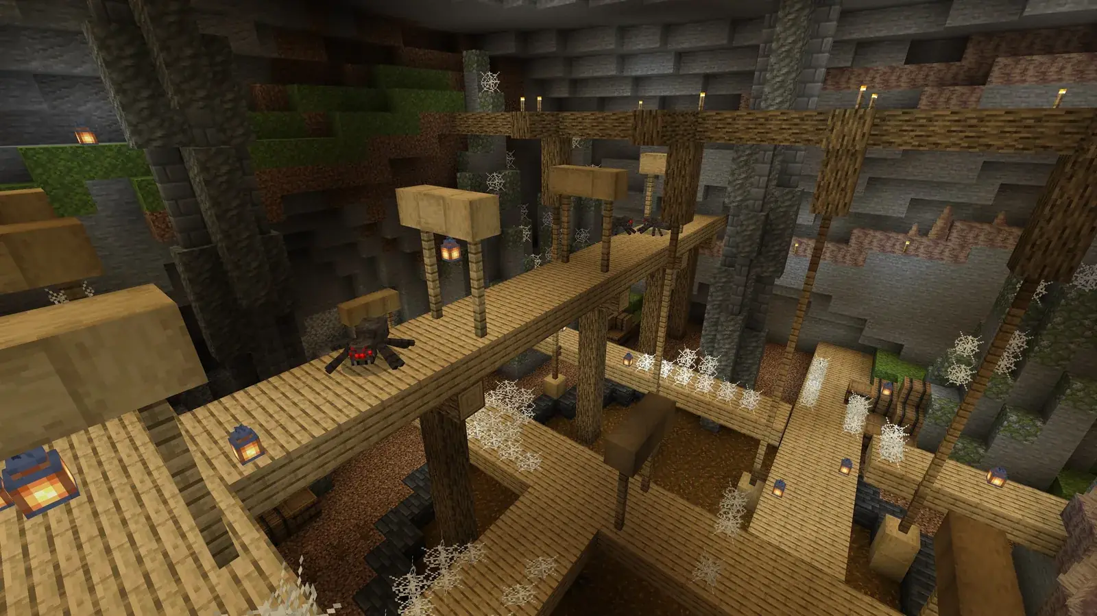 Scéna z Minecraft Education: důlní lávky v jeskyni