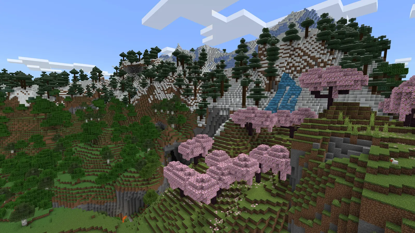 Krajina Minecraftu s několika biomy, třešňovým hájem a horami