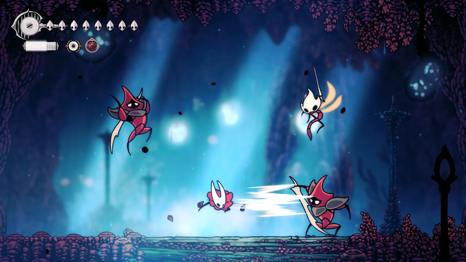 Hornet útočí jehlou na dva nepřátele v modře osvětlené jeskyni