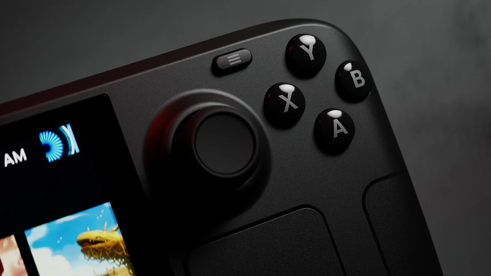 Detail pravé poloviny Steam Decku OLED: tlačítka ABXY, páčka, trackpad a tlačítko …